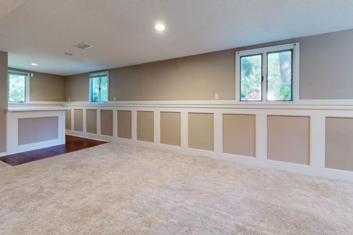 Bright finished basement with large windows letting in natural light